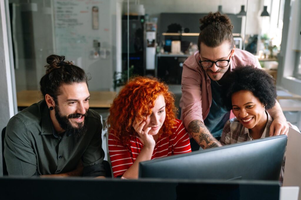 Group of business people and software developers working as a team in office
