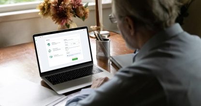 Old man talk on video call on laptop with colleague
