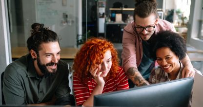 Group of business people and software developers working as a team in office