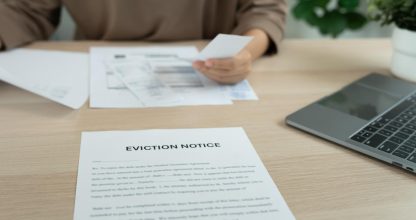 woman is stressed due to imminent seizure of assets, debts, financial problems, loans, guarantees document with the text eviction notice, debt, property, loan, agent, bankruptcy