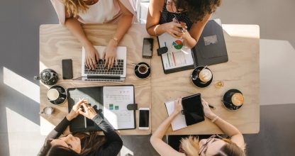 Group of women working together in coffee shop