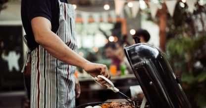 Asian man are cooking for a group of friends to eat barbecue