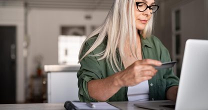 Mature woman doing online payment