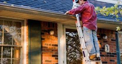Man Cleaning Gutters