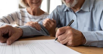 Old couple make agreement sign insurance contract