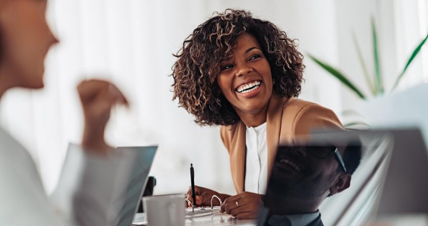 Portrait of cheerful businesswoman smiling at the meeting