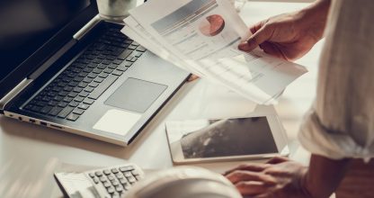 Hand of Business people working document about budget profits and planning of construciton project