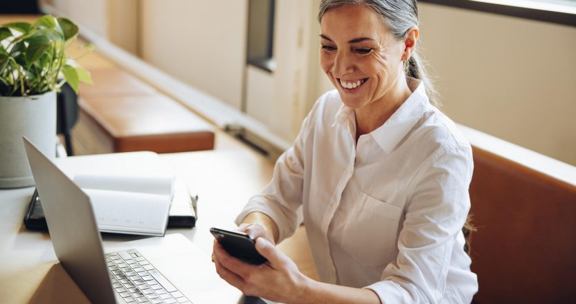 Mature businesswoman using mobile phone