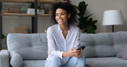 Happy biracial woman calculate finances and savings