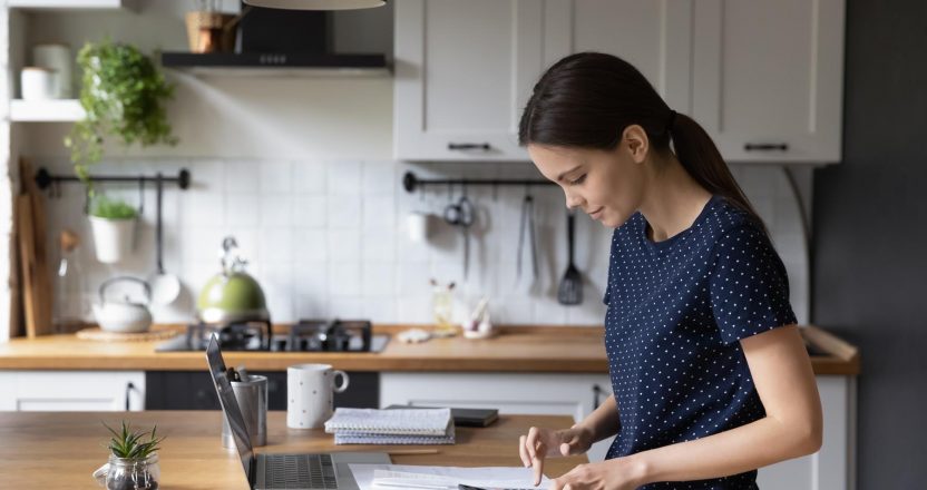 Woman calculate expenses, makes personal finances analysis