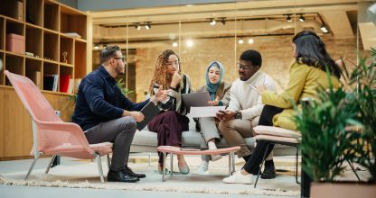 Multiethnic Group of Creative People Working on Project in a Mod