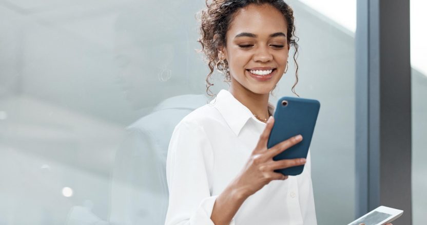Professional woman and tablet with mobile phone at a company is typing a conversation on the internet. Female person, business and communication with tech for entrepreneurship at the office.