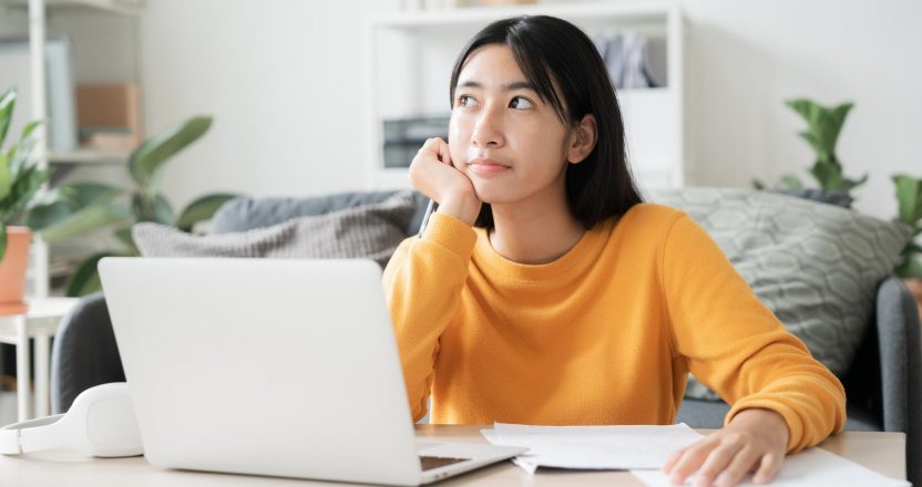 Asian girl work using laptop computer, online learn video conference
