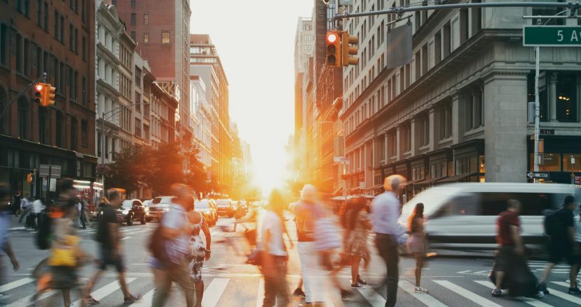 Busy intersection is crowded with people and traffic on 23rd Street in Manhattan New York City NYC