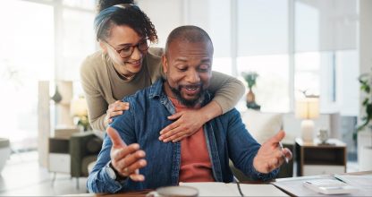 Financial paperwork, hug or excited African couple with budget or household planning in home. Happy, profit or people with form documents for accounting report of investment growth, taxes or salary