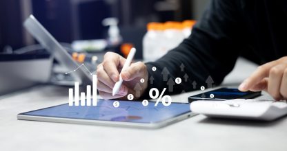close up manager man hand write summary data by checking annual report and calculate about commission rate form company's project after complete deal in office room for business lifestyle concept